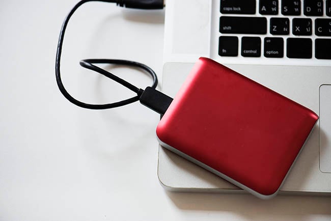 Red external hard drive - disaster recovery.