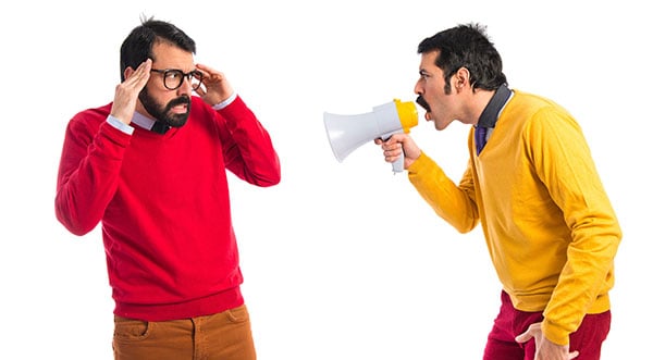 Man shouting at other man with a megaphone, perhaps about Word shortcuts
